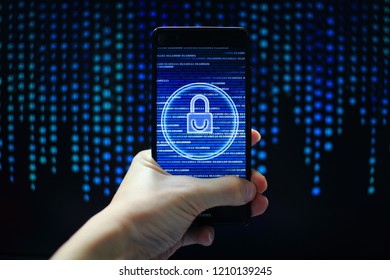 protected in stream of data flow. padlock icon symbolise security and motion movement of binary code computer data moving in the background. hand holding mobile phone.