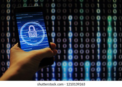 protected in stream of data flow. padlock icon symbolise security and motion movement of binary code computer data moving in the background. hand holding mobile phone.