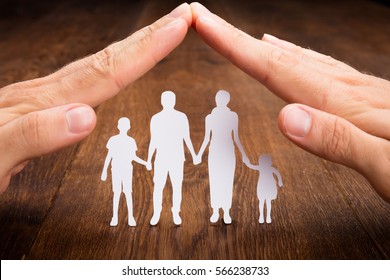 Protecting Family - Shutterstock ID 566238733