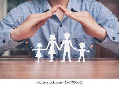 Protecting Hands Over Paper Family, Family Protection And Stay Home Or Working At Home With Care Concept