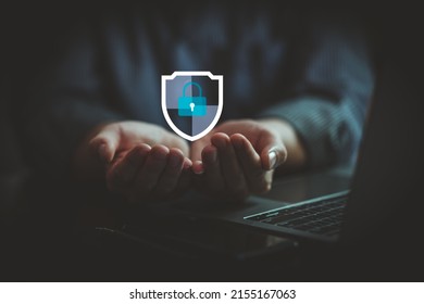 Protection network cyber security computer and safe your data concept, Businessman holding shield protect icon - Shutterstock ID 2155167063