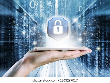 Protection network security computer in the hands of a businessman on a blue background.