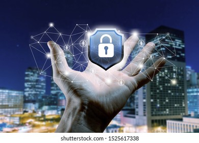 Protection network security computer in the hands of a businessman on a blue background.