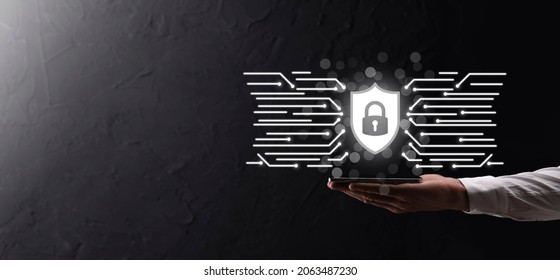 Protection network security computer and safe your data concept, Businessman holding shield protect icon. lock symbol, concept about security, cybersecurity and protection against dangers.