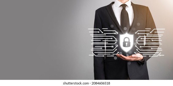 Protection network security computer and safe your data concept, Businessman holding shield protect icon. lock symbol, concept about security, cybersecurity and protection against dangers.