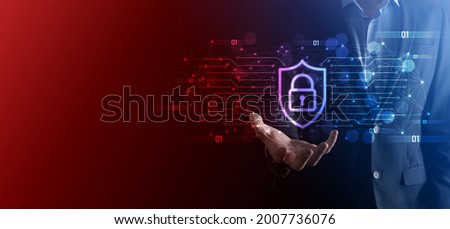 Protection network security computer and safe your data concept, Businessman holding shield protect icon. lock symbol, concept about security, cybersecurity and protection against dangers.