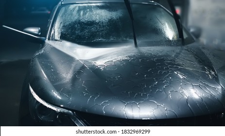 Protective Ceramic Hydrophobic Layer On Car, Washing Hood With High Pressure Water, Close Up