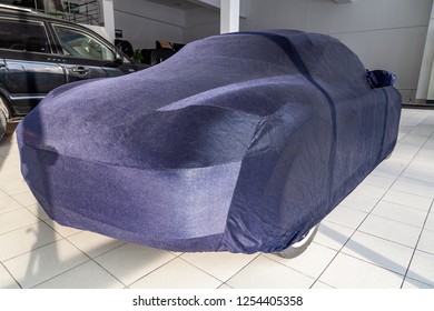 Protective Cover Awning For Cars, Blue, Made From Special Material, Bespoke At The Auto Repair Shop, Covering An Expensive Sports Car, Prepared For Winter Storage And Exploitation.