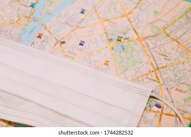 Protective face mask on city map background. World pandemic. Copy space. May 2020 - Kamianske/Ukraine  - Shutterstock ID 1744282532