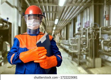 A protective gear or workwear for an industrial electrical engineer includes a face mask to protect against covid-19 coronavirus infection during a pandemic. - Powered by Shutterstock