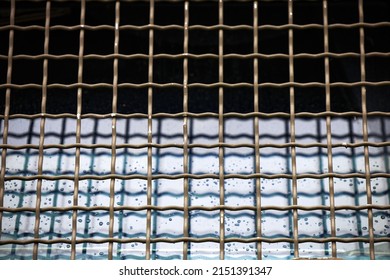 Protective Grille On The Windshield Of An Armored Car. Police Armored Car With Glass Protection. MRAP Armored Transport Vehicle.