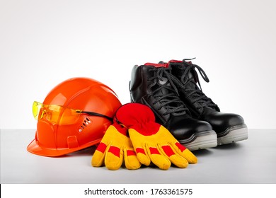 Protective Helmet, Boots, Gloves And Glasses. Standard Construction Safety.