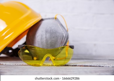 A Protective Helmet And Dust Mask Is Necessary On Any Construction Site.