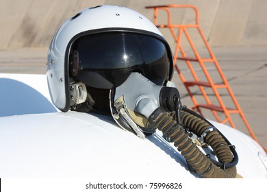 Protective Helmet Of The Pilot Against The Plane With An Oxygen Mask On A Fuel Tank