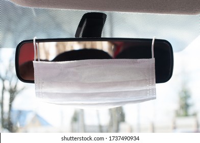 Protective Mask On The Rearview Mirror