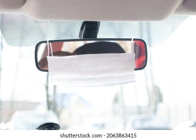 Protective Mask On The Rearview Mirror