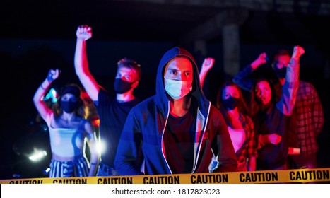 In protective masks. Group of protesting young people that standing together. Activist for human rights or against government.
