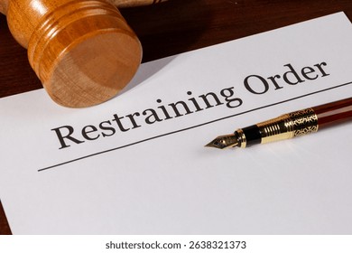 Protective Order Document on Judge’s Table with Gavel – Law and Safety Representation