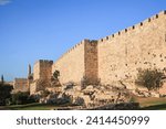 Protective powerful walls of the Old City of Jerusalem at sunset. Jerusalem is the capital of Israel. Ancient citadel Tower of David near Jaffa Gate. 