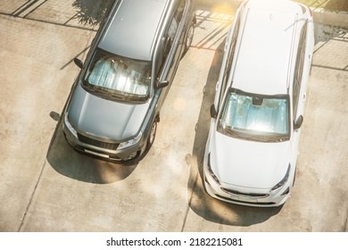 Protective reflective surface under the windshield of the passenger silver and white cars parked on a hot day, heated by the sun's rays inside the car