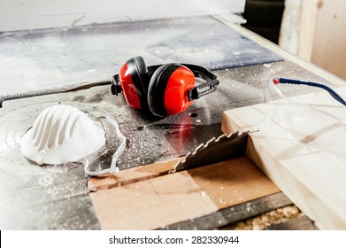 Protective wear for carpentry, eyeglasses, dust mask and earphones - Powered by Shutterstock