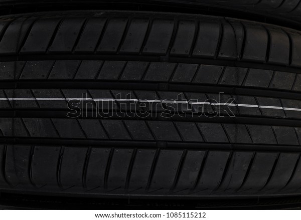 Protector of automobile tires. Close up\
view on auto mobile new wheel tire surface. Car constraction\
industry commercial transport\
transpotration.