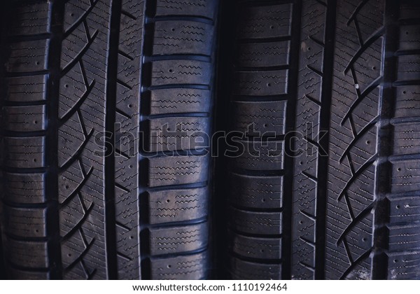 Protector of\
automobile tires. A number of automobile tires. Close up view on\
auto mobile new wheel tire\
surface.