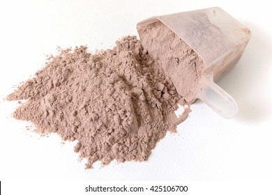 protein powder and scoops on white background