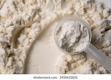 Protein whey powder with scoops. Food supplement, bodybuilding, fitness and gym lifestyle.  - Powered by Shutterstock