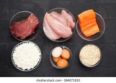 Proteins, Fish, Cheese, Eggs, Meat And Chicken On A Black Background