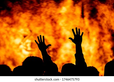 Protest fire, hands raised in unity