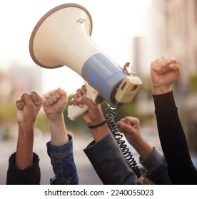 Protest, fist hands and megaphone in city street for solidarity, fight for human rights or government law change in community. Diversity support, justice and black people crowd for freedom of speech - Powered by Shutterstock