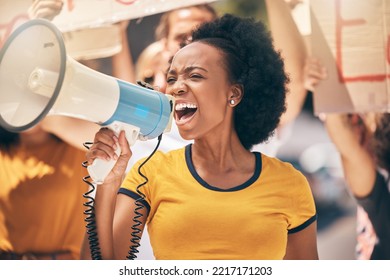 Protest, megaphone and speech of angry black woman at rally. Loudspeaker, revolution and speaking, screaming or shouting leader on bullhorn protesting for human rights, justice and freedom in city. - Powered by Shutterstock