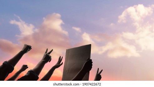 Protest, Mob, Expression and Strike Concept.  Silhouette of People Raise Up Hands into the Sky. the Leader Holding a Corrugated Paper. - Shutterstock ID 1907422672