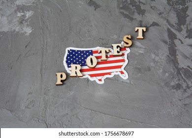 Protest sign flat lay on a gray background with american flag.