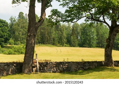 Protestant Church, Bell Tower And Cemetery In Lerbo, Södermanland. Stone Gravestones, Wood Crosses.