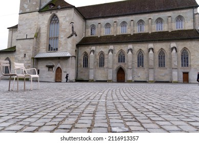 Protestant Church Women's Minster With Paving Stones At Minster Square In The Old Town Of Zürich At A Gray And Cloudy Winter Day. Photo Taken February 1st, 2022, Zurich, Switzerland.