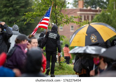 Protester With An American Flag And 