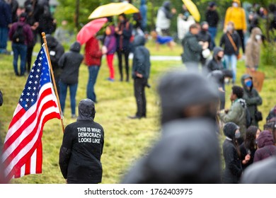 Protester In A Crowd With An American Flag And 