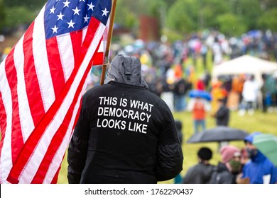 Protester Demonstrating An American Flag And 