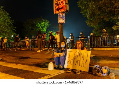 Protesters Have A Sign Of 