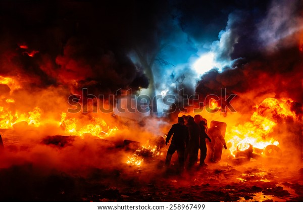 Protesters walk on\
fire