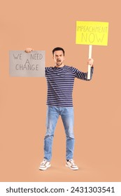 Protesting young man holding placards on beige background. Impeachment concept