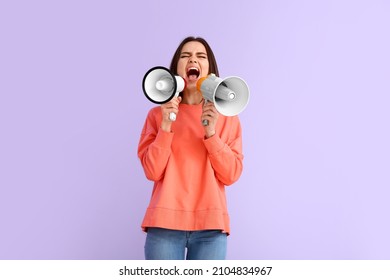 Protesting Young Woman With Megaphones On Color Background