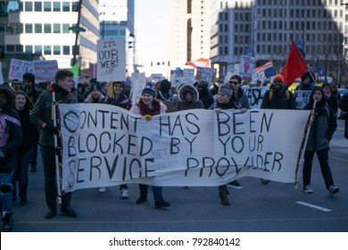 Protestors advocating for net neutrality rally on the streets of Philadelphia, Saturday, January 13, 2018.
