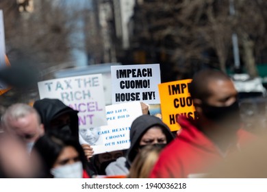 Protestors Call To Tax The Rich And Impeach Governor Andrew Cuomo Following Allegations Of Sexual Misconduct And A Covering-up COVID-19 Related Nursing Home Deaths On March 20, 2021 In New York City. 