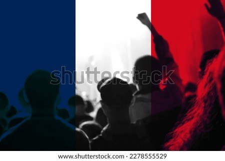 Protests France Paris. France flag. Protest in France. Rise hand. Pension reforms. Retirement age. Bastille day. Out of focus.
