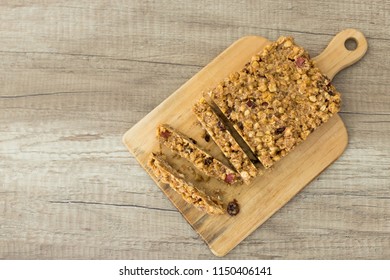 Protien Bar On Wooden Plate. (top View)