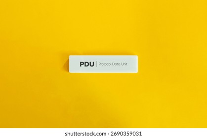 Protocol Data Unit PDU Text on Wide Letter Tile over Yellow Background – Minimal Design Concept for Network Communication and Data Transmission