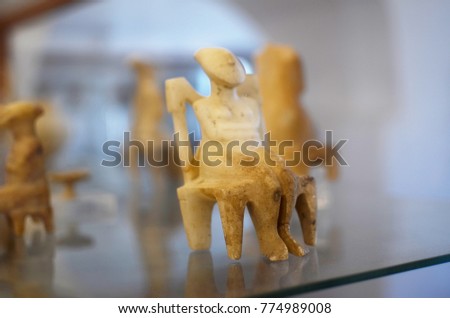 Protocycladic idol in museum display